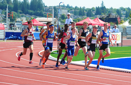 photo of youth athletes running, he is not wearing Skunk Skin Socks the best socks for sweaty stinky feet